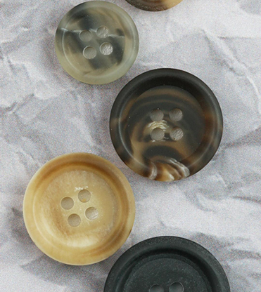 Rock, Paper, Scissors, And… This time paper wins with our Recycled Paper buttons!